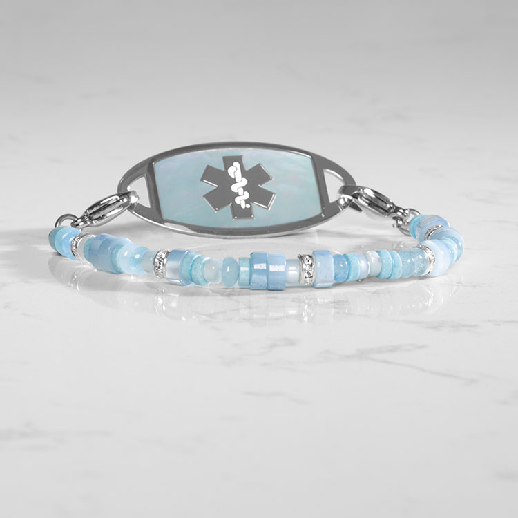 Baby blue mother of pearl heishi beads on medical ID bracelet strand with blue mother of pearl medical ID tag