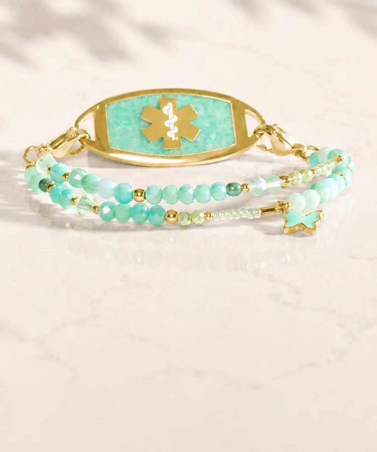 Amazonite beaded bracelet with amazonite medical ID tag on sunlit background