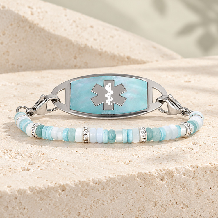 Baby blue mother of pearl heishi beads on medical ID bracelet strand with blue mother of pearl medical ID tag
