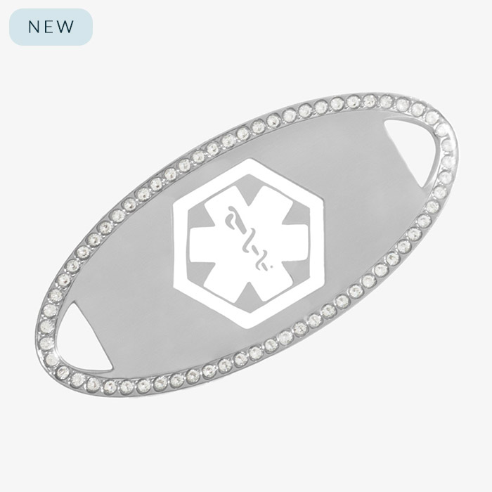 Silver-tone medical ID tag with a border of clear cubic zirconia crystals and an engraved white medical caduceus symbol in the center.