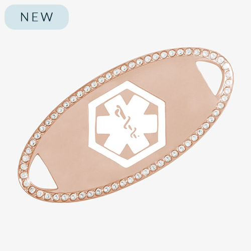 Rose gold-tone medical ID tag accented with a border of clear cubic zirconia crystals and a white engraved medical caduceus symbol in the center.