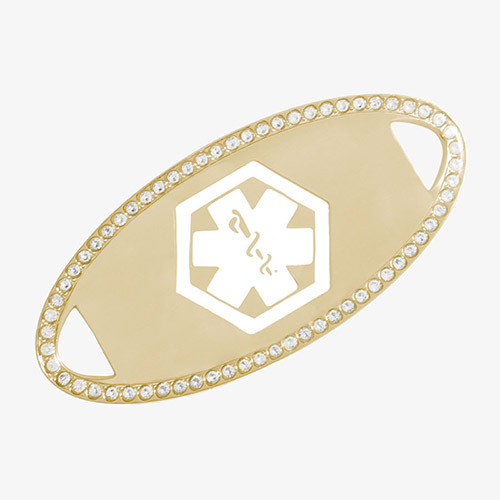Gold-tone medical ID tag bordered with clear cubic zirconia crystals, featuring a white engraved medical caduceus symbol in the center.