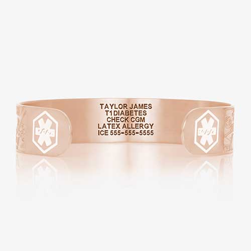 Front of medical alert bracelet in rose gold with white medical symbols and custom laser engraving