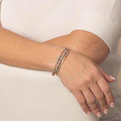 Interchangeable multi strand bracelet: Sterling silver, crystal, and rose gold tone beads shown on wrist