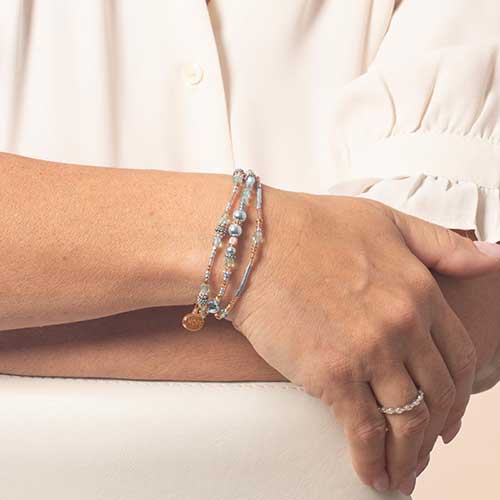 Interchangeable multi strand bracelet: Sterling silver, crystal, and rose gold tone beads shown on wrist