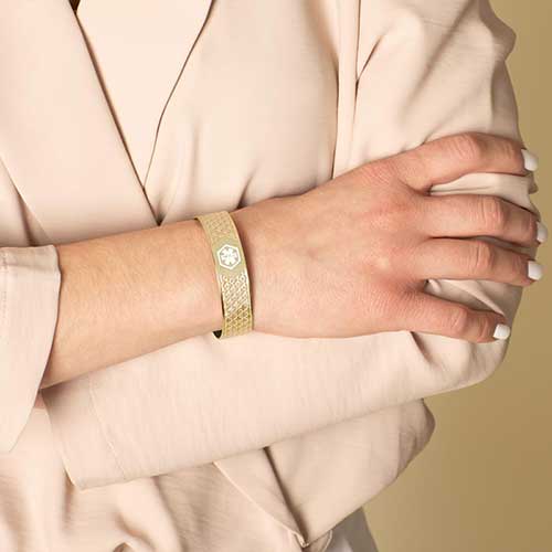 Woman wearing Mae Gold Med ID Cuff