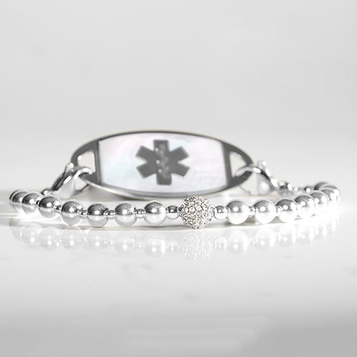 B654 - Olivia Stretch Bracelet with silver beads and mother of pearl with silver medical symbol on slate