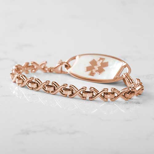 Rose Gold Lennox Medical ID Bracelet with Mother of Pearl tag on White Marble Counter