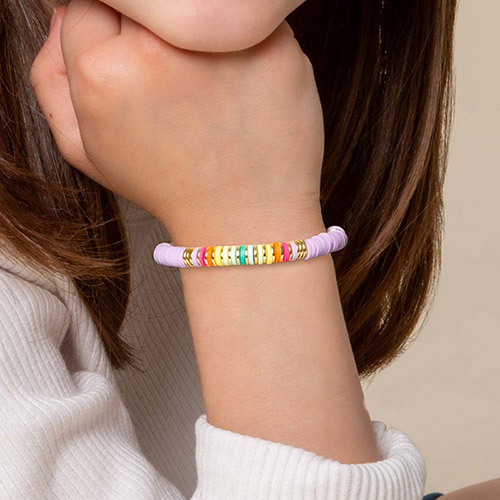 Girl Power Stretch Medical ID Bracelet, shown on wrist with playful lavender, gold, and rainbow colors, ideal for young individuals