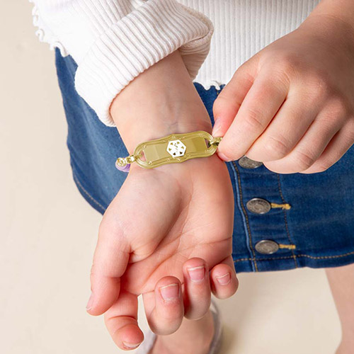 Trendy Girl Power Medical Alert Bracelet in rainbow colors, designed for easy on-and-off wear with comfortable stretch material