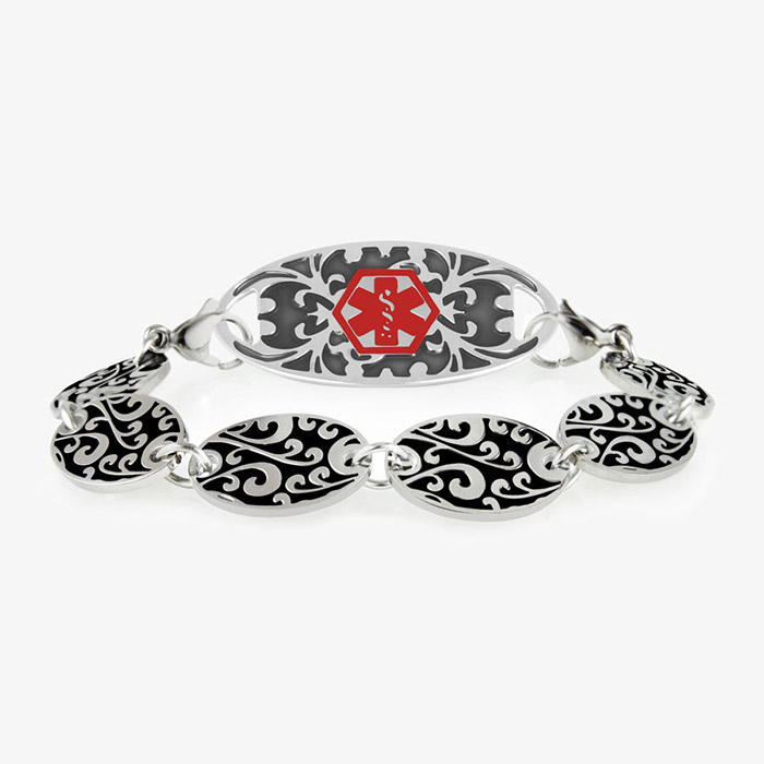 Decorative chain bracelet with circular patterned links and intricate medical alert tag