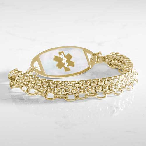 Three strand gold tone chain medical ID bracelet with decorative gold tone stainless steel med ID tag with mother of pearl inlay and gold symbol