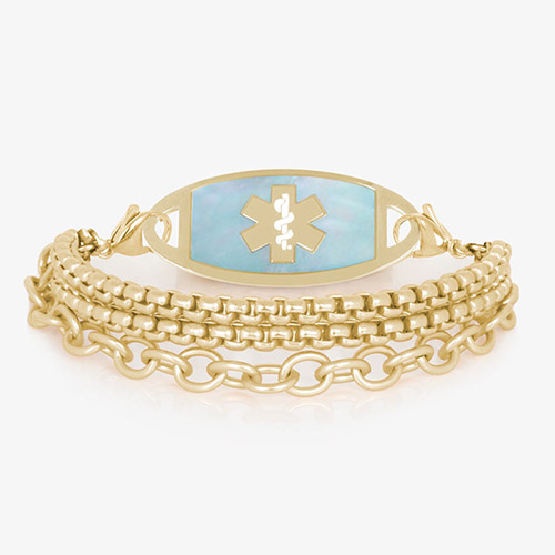Three strand gold tone chain medical ID bracelet with decorative gold tone stainless steel med ID tag with blue mother of pearl inlay and gold symbol