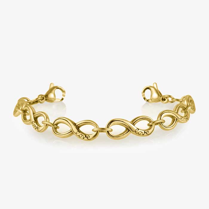 Low view of gold tone chain with infinity symbol links and medical alert tag