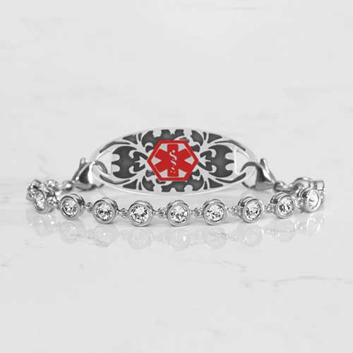 Rhodium and palladium plated women's medical alert bracelet with clear, round, bezel set cubic zirconia crystals paired with a stainless steel Filigree medical ID tag.
