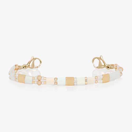 White and gold beaded stretch medical ID bracelet finished with gold tone stainless steel lobster clasps.