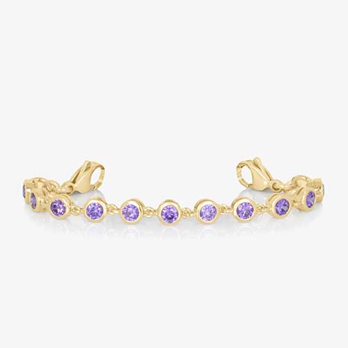 12k gold plated chain with round, bezel set amethyst cubic zirconia crystals finished with gold tone stainless steel lobster clasps at each end.