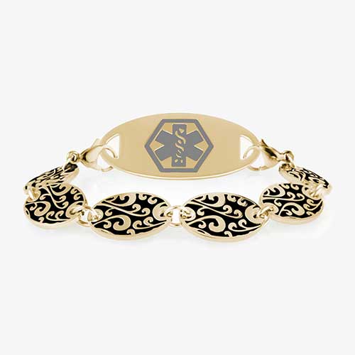 Gold Tone Decorative chain bracelet with circular patterned links and grey and gold tone medical alert tag.