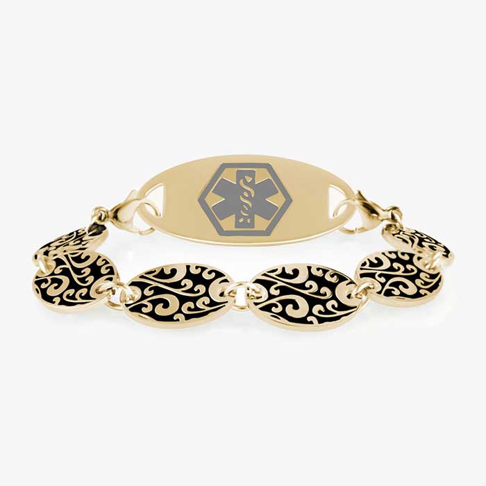 Gold Tone Decorative chain bracelet with circular patterned links and grey and gold tone medical alert tag.