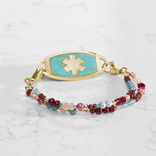 Dahlia Beaded Medical ID bracelet with Gold and Turquoise Medical ID tag on white marble counter