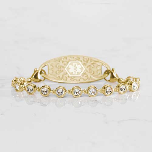 Ella Medical ID Bracelet in Gold with Cubic Zirconia Crystals on White Marble