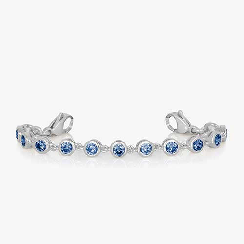 Rhodium and palladium plated women's medical alert bracelet with sapphire tone, round, bezel set cubic zirconia crystals finished with stainless steel lobster clasps at each end.