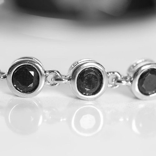 Close-up of the Ella Medical alert bracelet in black and silver with custom engraved medical ID tag, highlighting its fashionable design for women.