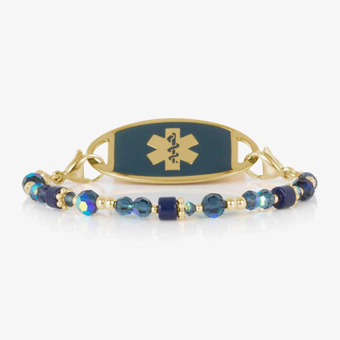 Blue and gold beaded medical ID bracelet on jewelry elastic with gold tone lobster clasps and sapphire blue decorative med ID tag.