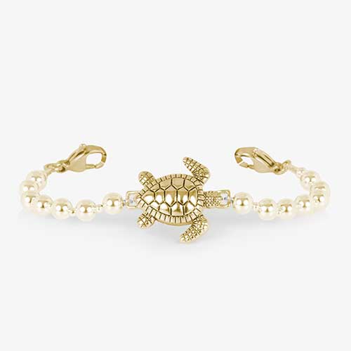 Gold tone beaded bracelet featuring a sea turtle centerpiece.
