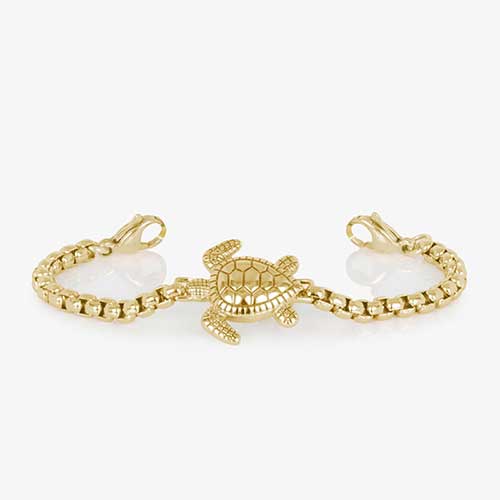 Gold tone beaded bracelet featuring a sea turtle centerpiece, attached to a gold tone medical ID with mother of pearl inlay.