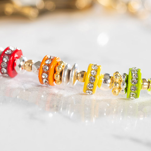 Close-up of bracelet details on Capri Multicolor Beaded Medical Alert Bracelet, showcasing vibrant beads and pave-set CZs with gold and silver accents