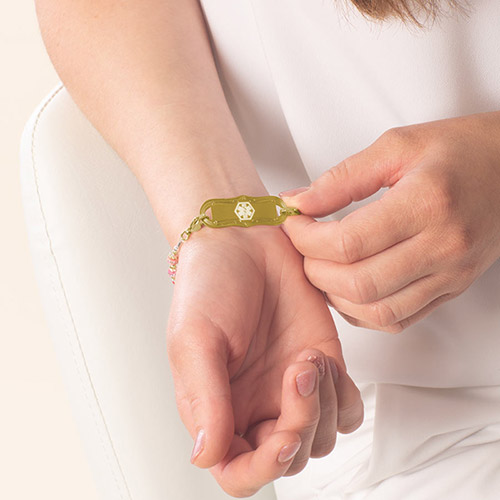 Capri Multicolor Stretch Medical ID Bracelet with colorful beads, shown on wrist, paired with a Lauren’s Hope medical ID tag