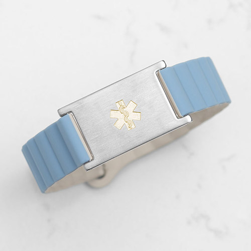 Hypoallergenic Urban MagSport medical alert bracelet in Powder Blue, paired with a brushed silver Urban Gemini ID tag and gold-tone medical symbol