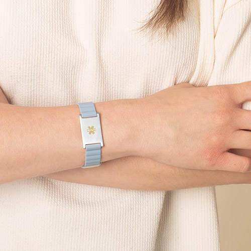 Urban MagSport Medical alert bracelet in Powder Blue on wrist, with adjustable silicone band and stainless steel medical ID tag, perfect for sensitive skin