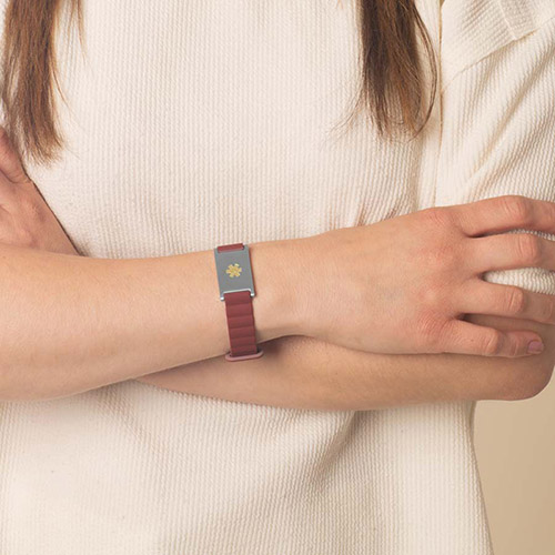 Fully magnetic Urban MagSport Medical ID Bracelet in Merlot on wrist, shown with Lauren’s Hope custom engraved medical ID tag, designed for style and safety