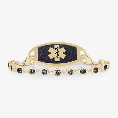 Gold medical ID bracelet with black crystal chain and midnight blue inlay, featuring a Star of Life emblem for stylish safety wear.
