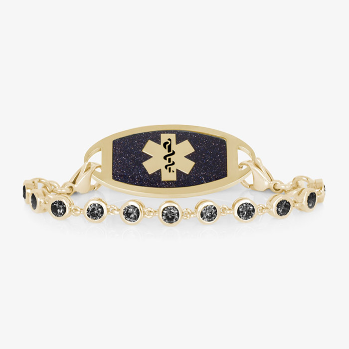 Gold medical ID bracelet with black crystal chain and midnight blue inlay, featuring a Star of Life emblem for stylish safety wear.