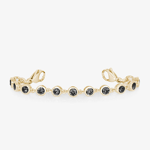 Gold bracelet extender with black crystal links and lobster clasps, designed to customize the fit of a medical ID bracelet.