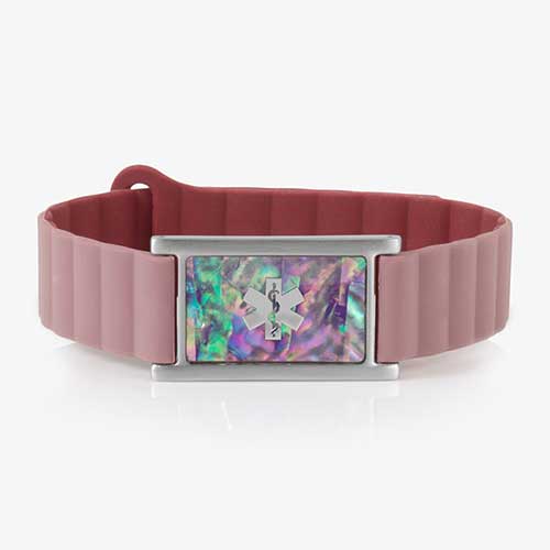 Mauve silicone medical ID bracelet with a rectangular silver tag featuring a lilac abalone inlay and engraved medical caduceus symbol on the front.