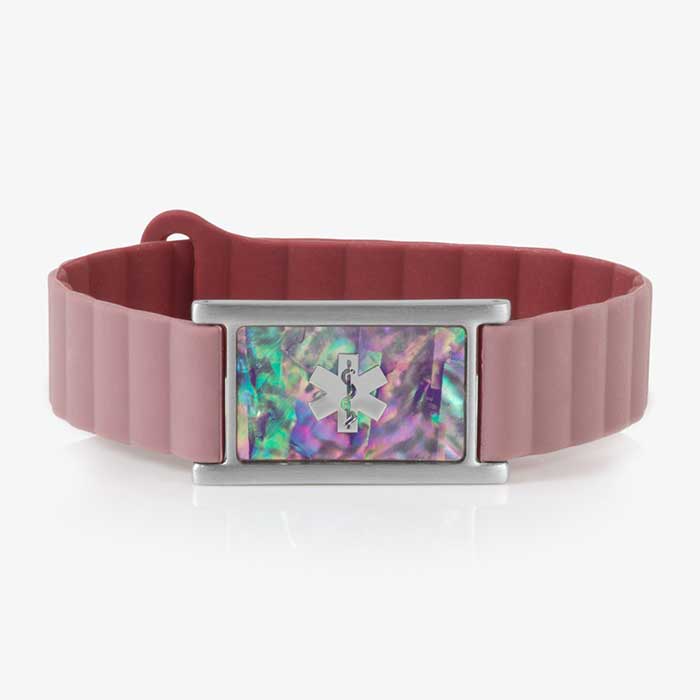 Mauve silicone medical ID bracelet with a rectangular silver tag featuring a lilac abalone inlay and engraved medical caduceus symbol on the front.