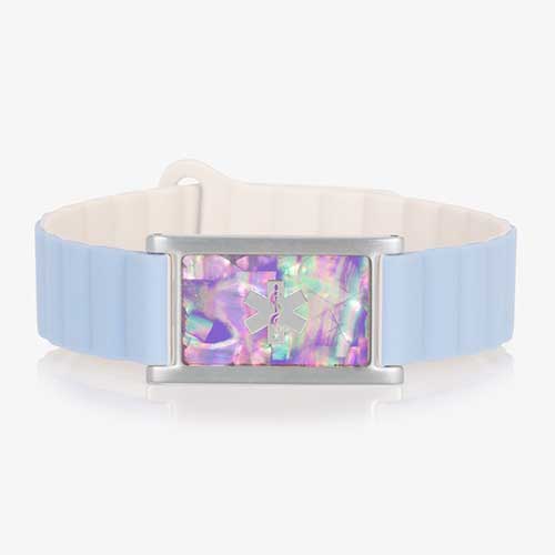 Front view of a medical ID bracelet with a light blue and cream silicone band and a rectangular tag featuring an iridescent lilac abalone inlay and a silver medical alert symbol.