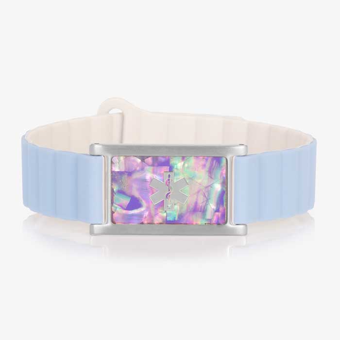 Front view of a medical ID bracelet with a light blue and cream silicone band and a rectangular tag featuring an iridescent lilac abalone inlay and a silver medical alert symbol.