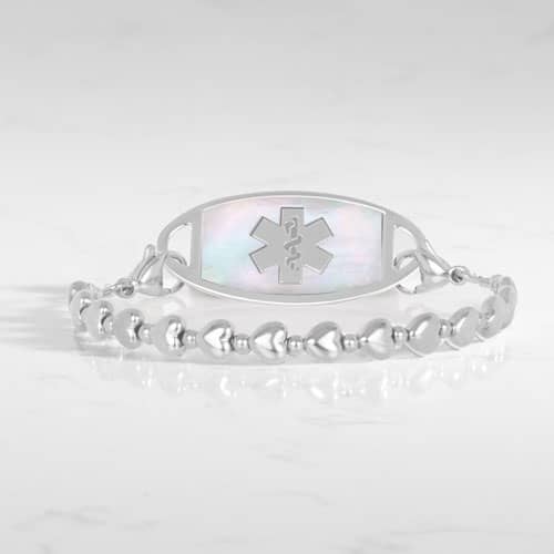 Silver beaded stretch medical alert bracelet with mother of pearl ID tag and caduceus symbol in elegant heart shape feminine design
