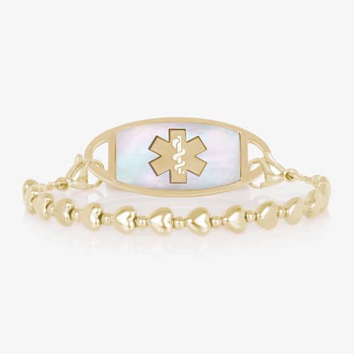 Gold beaded stretch medical alert bracelet with mother of pearl ID tag and caduceus symbol in elegant heart shape feminine design