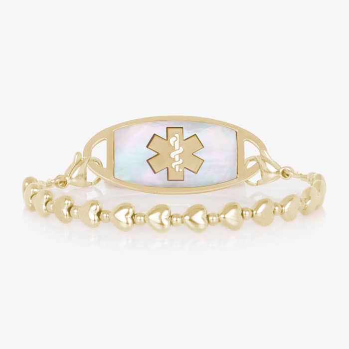 Gold beaded stretch medical alert bracelet with mother of pearl ID tag and caduceus symbol in elegant heart shape feminine design