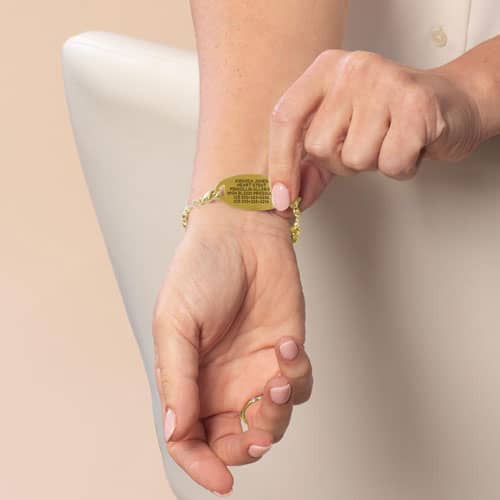 Close-up of the gold Medical ID Tag with the engraving