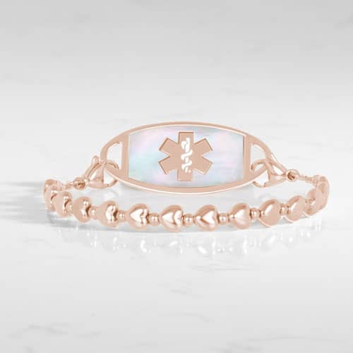 Rose Gold beaded stretch medical alert bracelet with mother of pearl ID tag and caduceus symbol in elegant heart shape feminine design