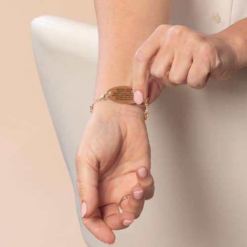 Close-up of the rose gold Medical ID Tag with the engraving