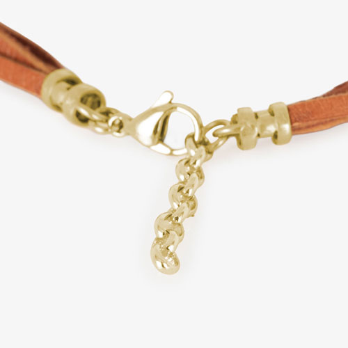 Brown suede leather bands attached to a gold clasp, fastening with a lobster claw clasp