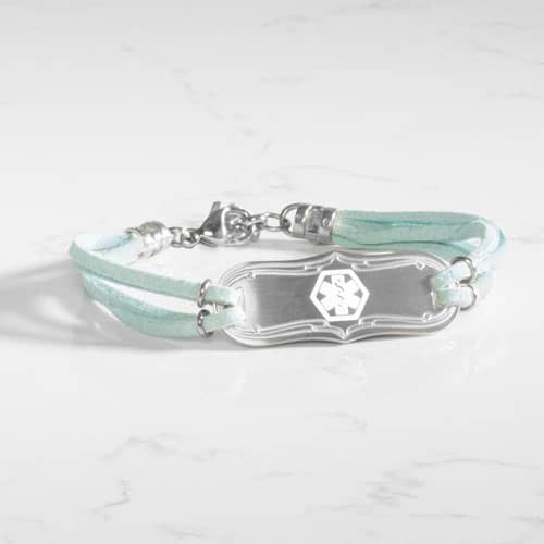 SmartSize Medical Id Bracelet with a light blue tone suede bands and adjustable chain attached to a Silver tone La Petite med ID tag